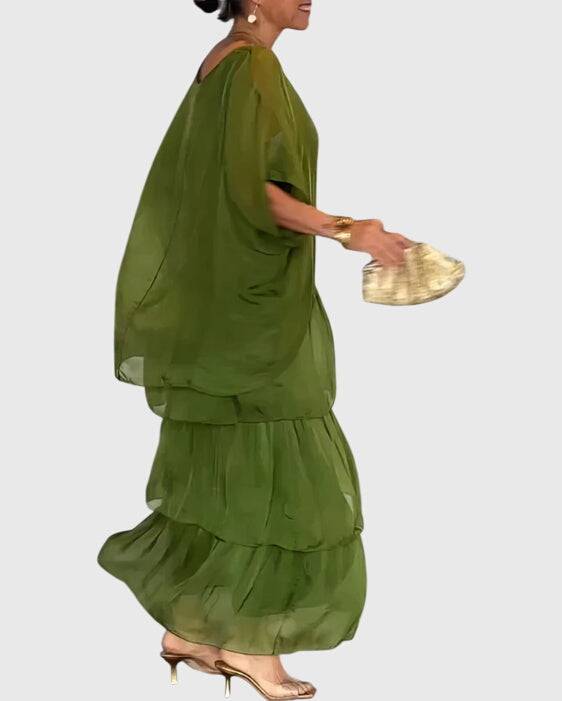 Elegant long flowing dress from Emma & Rose Cape Town featuring a stylish, graceful design perfect for formal occasions.