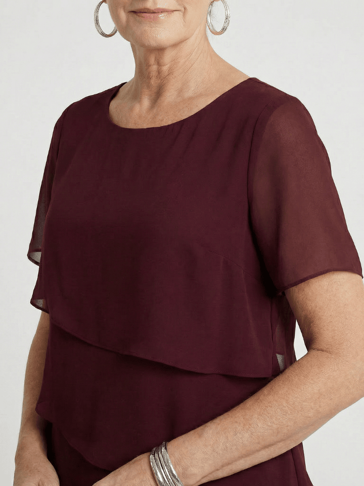 Orson™ Contour Knee Length Dress by Emma & Rose Cape Town, shown in a sleek, fitted design with elegant contour detailing.