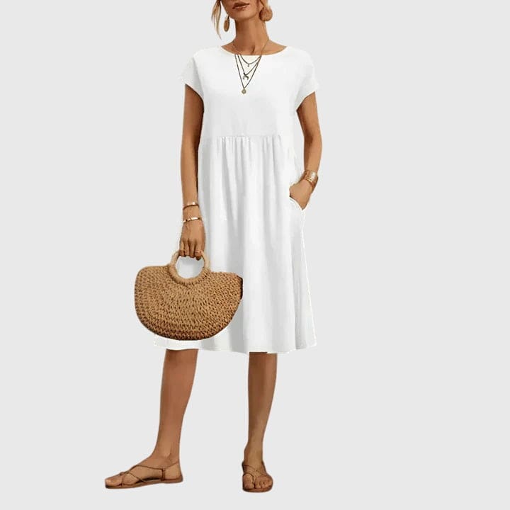 Elegant spring dress by Emma & Rose Cape Town featuring a flowy fabric and floral pattern, perfect for warm-weather occasions.