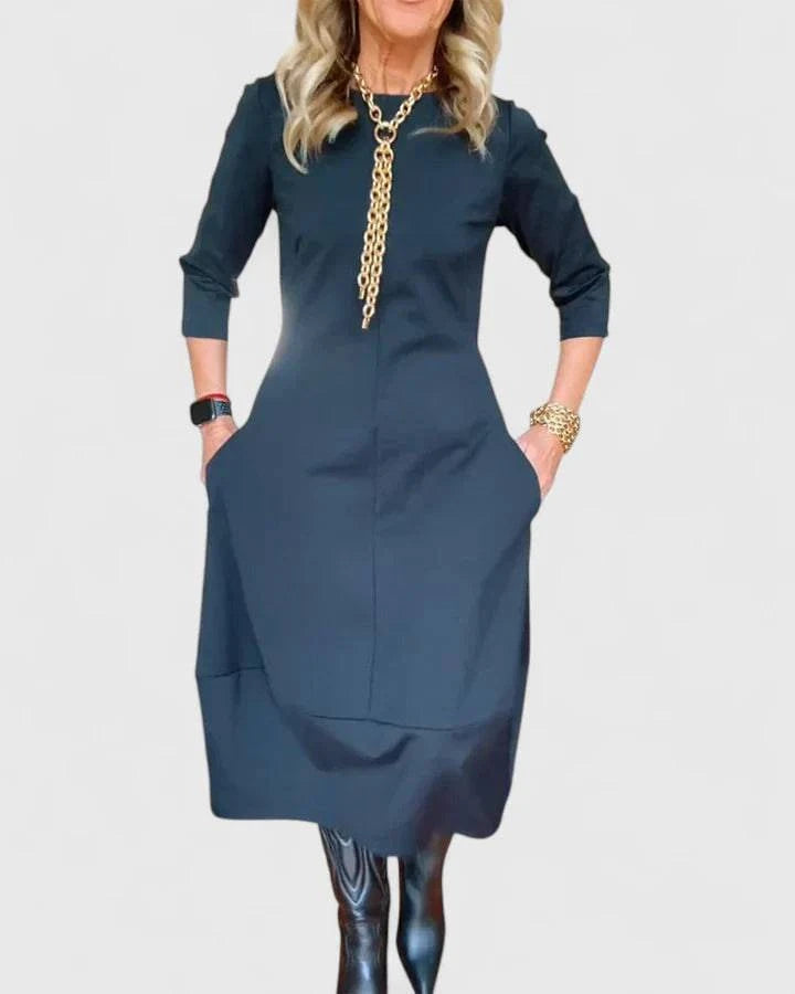 Elegant Danyshka™ midi dress by Emma & Rose Cape Town, featuring a flowing fabric and stylish design, shown on a model.