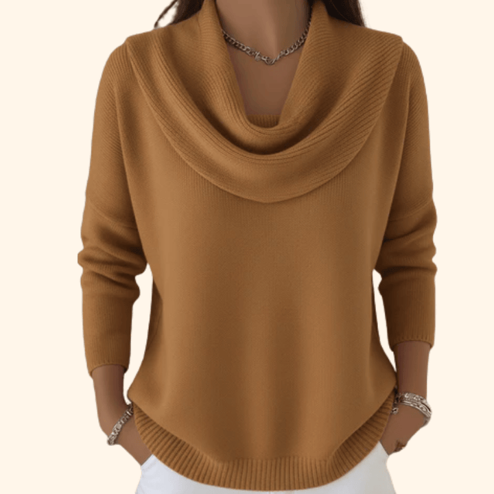 Cercie™ elegant sweater by Emma & Rose Cape Town, featuring a cozy knit design in neutral tones, displayed on a hanger.