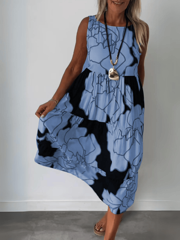 Emma & Rose Manhattan Teresa™ elegant floral print dress with a fitted bodice and flowing skirt, showcasing a vibrant floral pattern.