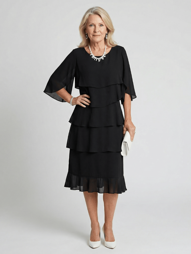 Emma & Rose Cape Town Brent™ layered tier midi dress, showing the flowy fabric and tiered design in a stylish, elegant silhouette.