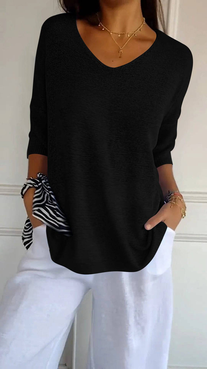 Emma & Rose Durban Jill™ timeless V-neck top in soft fabric, shown on a hanger with a subtle neutral background.