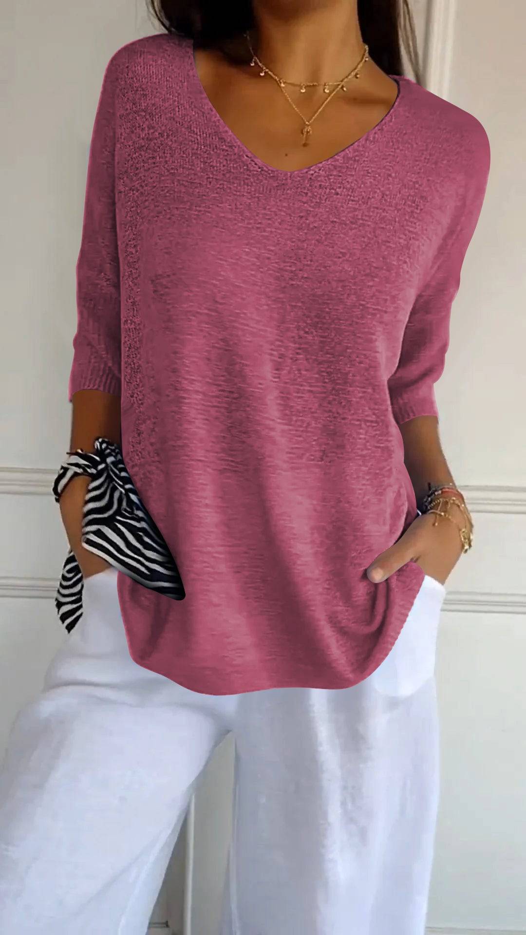 Emma & Rose Durban Jill™ timeless V-neck top in soft fabric, shown on a hanger with a neutral background.