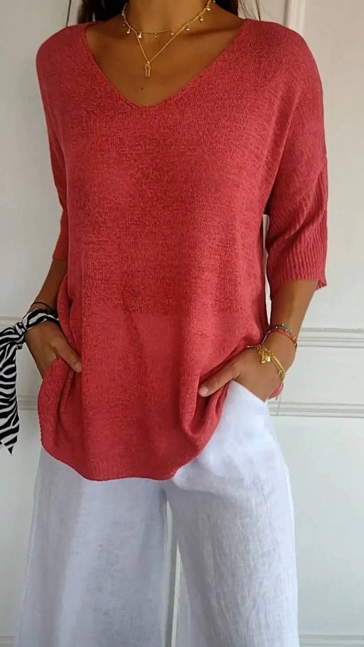 Emma & Rose Durban Jill™ timeless V-neck top in soft fabric, displayed on a hanger with a neutral background.