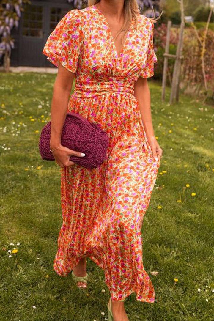 Emma & Rose Manhattan Pauline floral long dress featuring a flowing design and vibrant floral pattern.