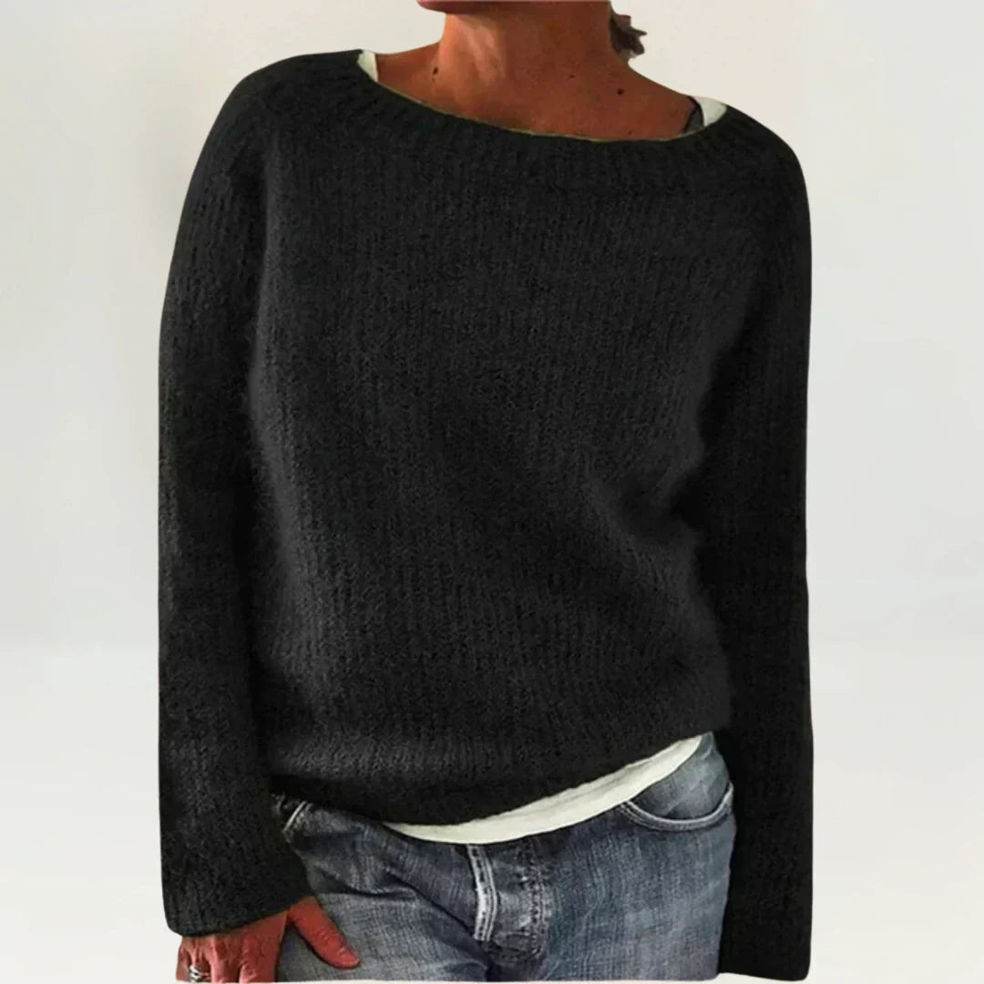 Black cozy sweater by Emma & Rose Cape Town, featuring a comfortable fit and soft knit fabric.