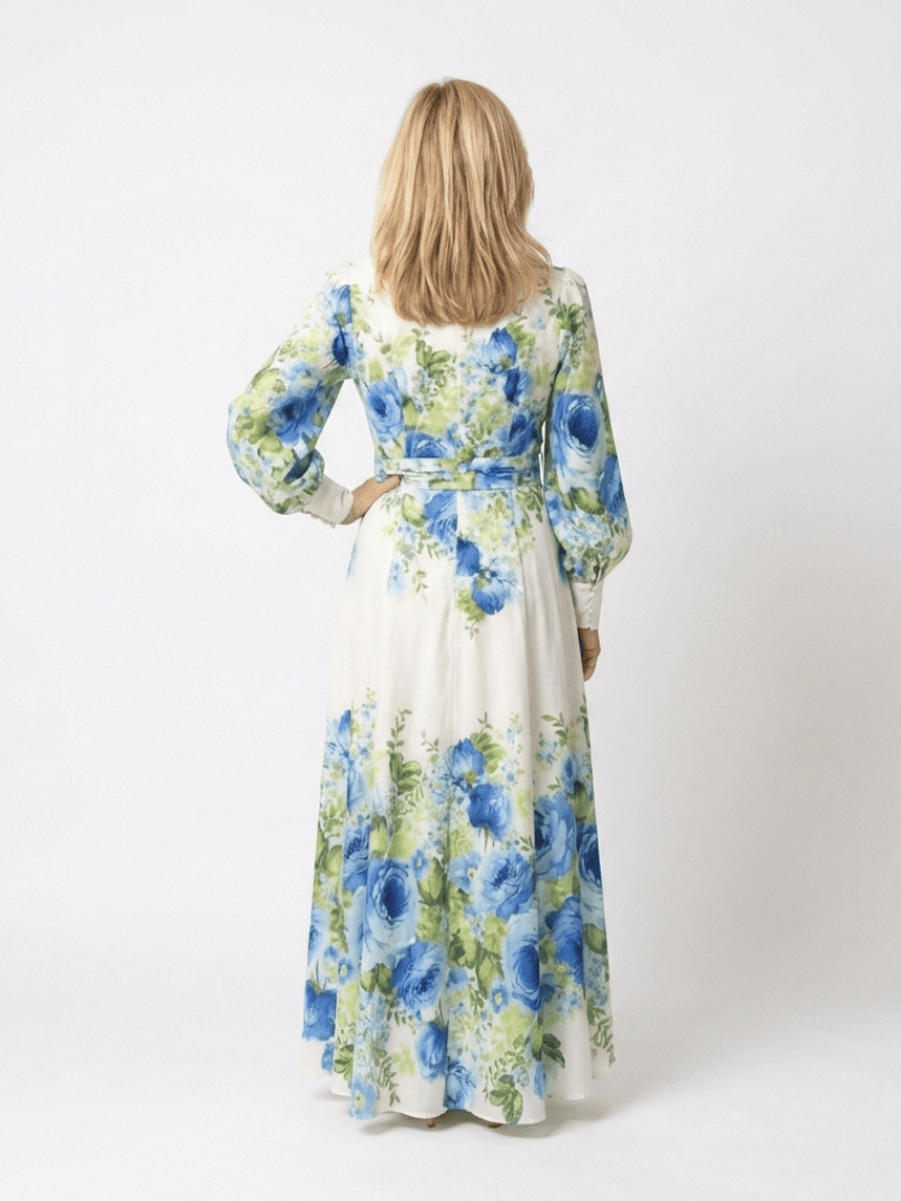 Emma & Rose Cape Town Harper™ button front maxi dress in floral fabric, flowing design with long sleeves and a fitted waist.
