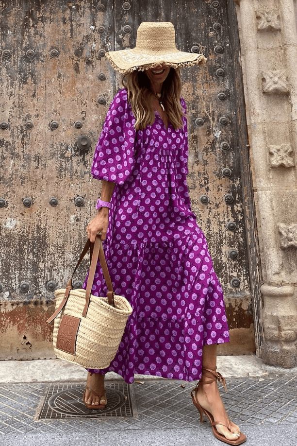 Emma & Rose Manhattan Vanessa™ long maxi dress with colorful floral print, flowing fabric, and sleeveless design.