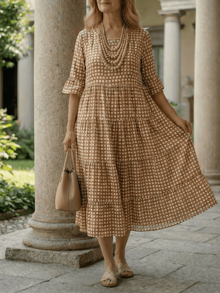Emma & Rose Cape Town Arlo™ Dot Tiered Midi Dress with layered fabric and polka dot pattern, stylish and lightweight for warm weather.