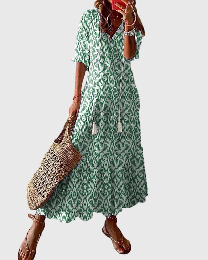 Emma & Rose Cape Town Amalia™ boho vintage summer dress featuring floral patterns and flowing fabric.