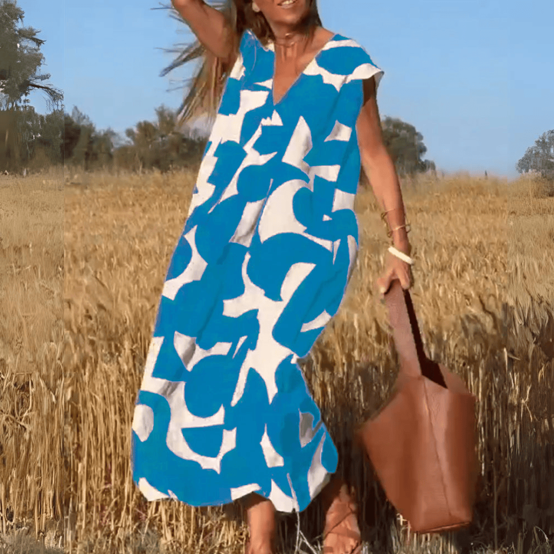 Emma & Rose Manhattan Elena™ printed V-neck casual dress with a relaxed fit, featuring vibrant floral patterns and soft fabric.