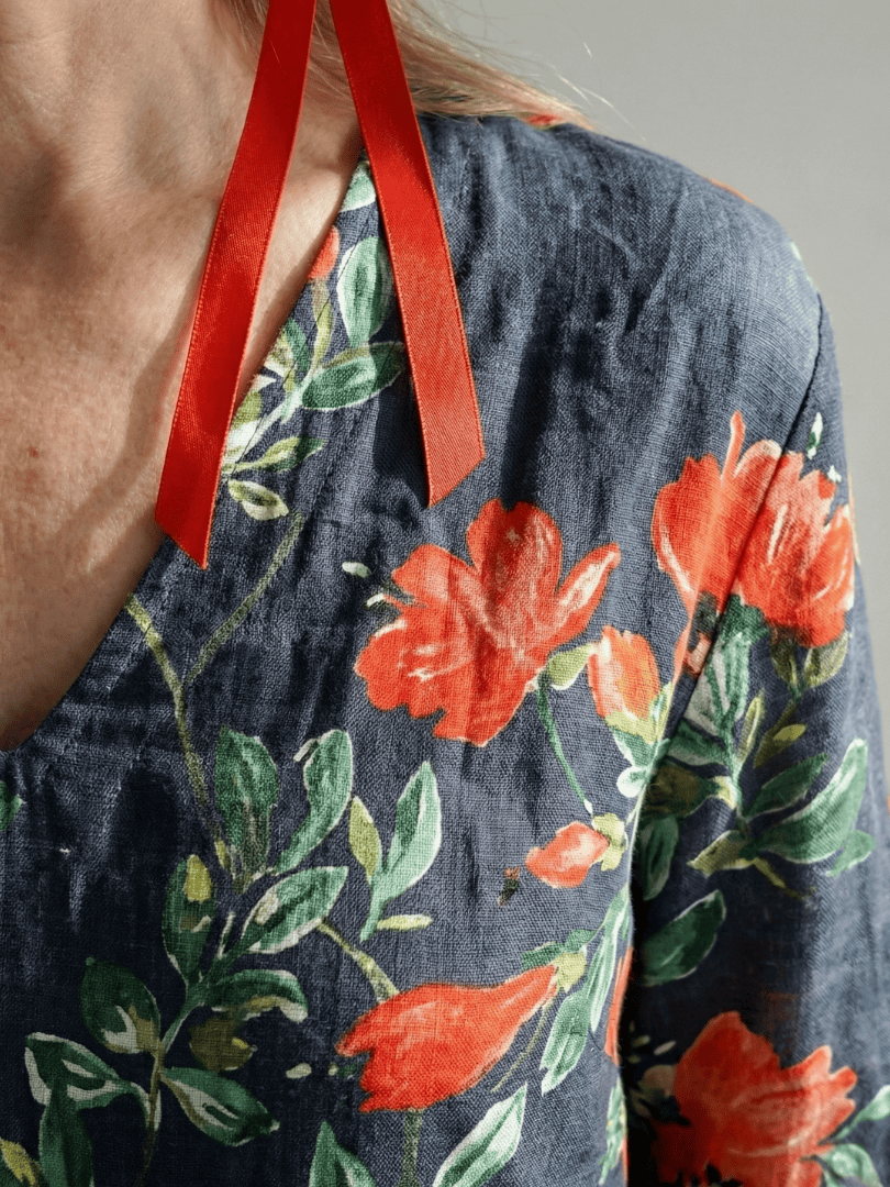 Cyrus™ Drape Floral Midi Dress by Emma & Rose Cape Town featuring a flowing silhouette and vibrant floral pattern.