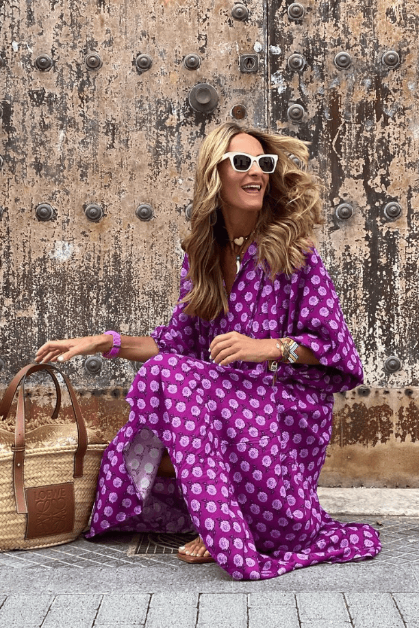 Emma & Rose Manhattan Vanessa™ long maxi dress with colorful floral print, flowing fabric, and sleeveless design.