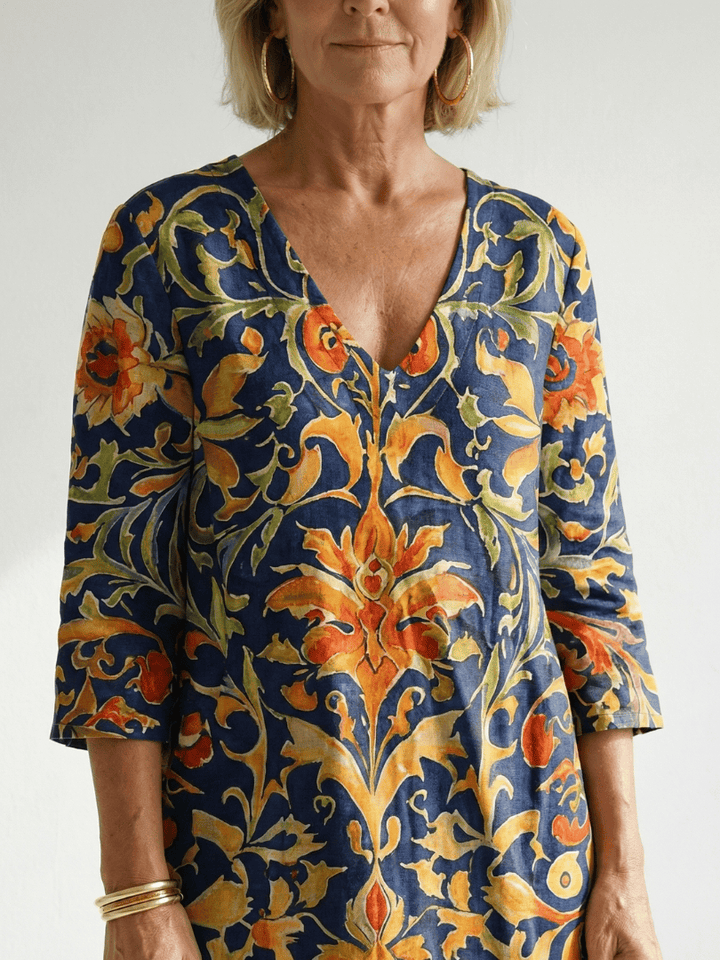 Emma & Rose Cape Town Elise™ Ornate Floral Midi Dress with intricate floral patterns and elegant flowing fabric.