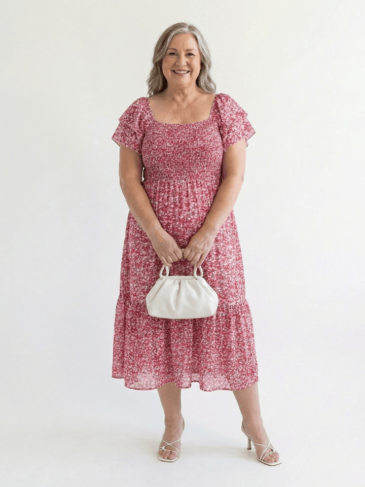 Odette Floral Smocked Midi Dress by Emma & Rose Cape Town, showcasing a feminine midi dress with floral pattern and smocked bodice.
