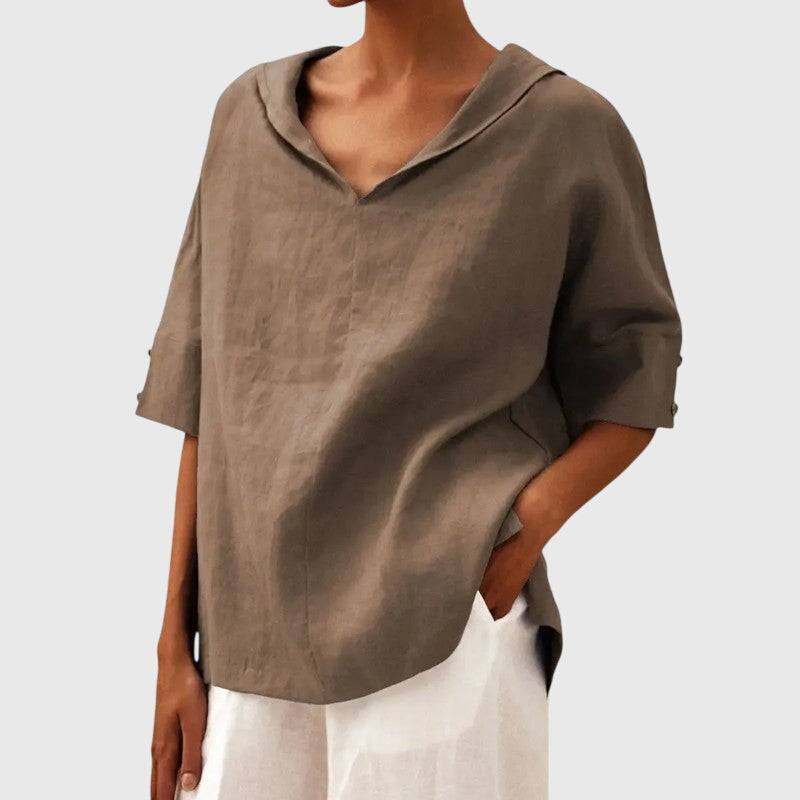 Ayla™ brown blouse by Emma & Rose Cape Town, featuring soft fabric and stylish design, displayed on a hanger.