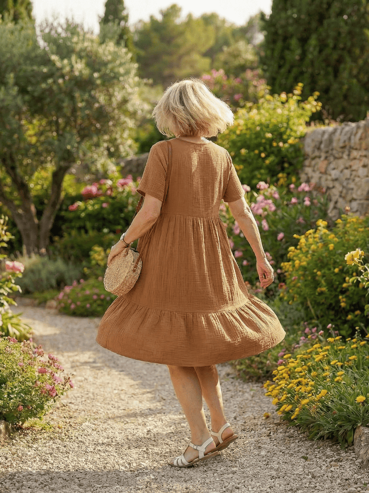 Delphinia™ Woven Ease Dress by Emma & Rose Cape Town displayed in a flowing, lightweight fabric with a relaxed fit on a model.