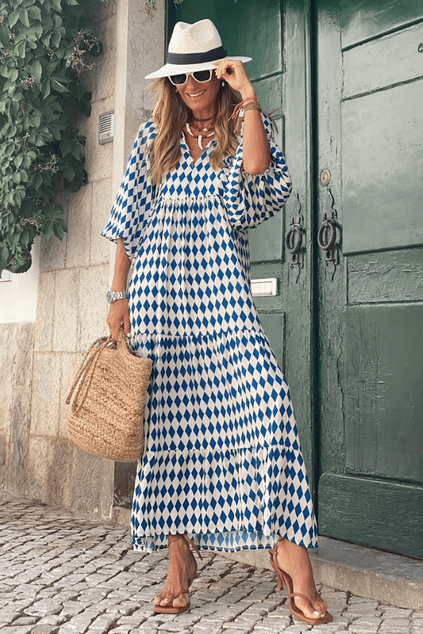 Emma & Rose Manhattan Vanessa™ long maxi dress with vibrant floral print, flowing fabric, and elegant design.