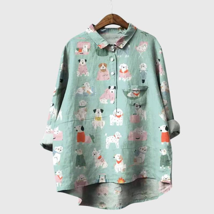 Elegant Emma & Rose Cape Town Elva™ blouse with delicate fabric and stylish design, displayed on a hanger.