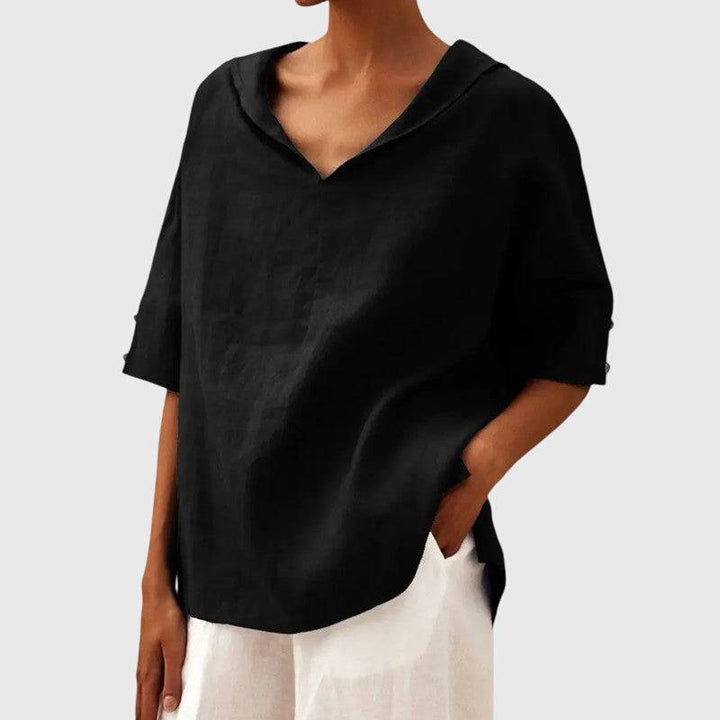 Ayla™ brown blouse by Emma & Rose Cape Town featuring long sleeves and a relaxed fit, shown on a hanger.
