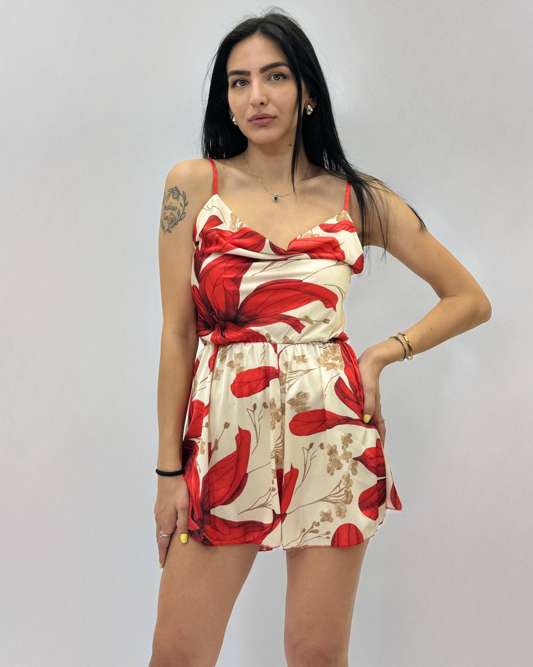 Emma & Rose Cape Town Pippa™ short jumpsuit with V-neck and waistband, featuring a stylish, fitted design, shown on a model.