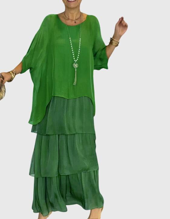 Long flowing elegant dress by Emma & Rose Cape Town, featuring a graceful design and soft fabric in a flattering silhouette.