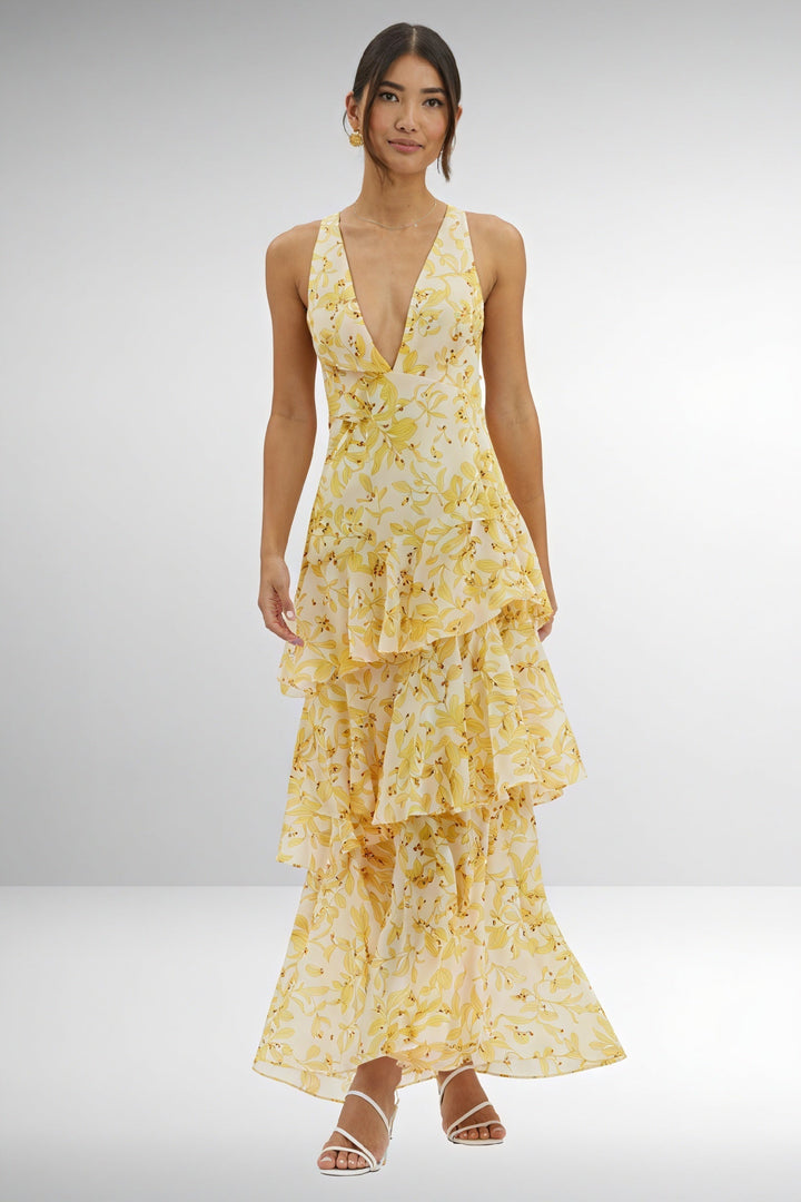Floral print dress with deep V-neck by Emma & Rose Cape Town, showcasing a lightweight fabric and vibrant flower pattern.