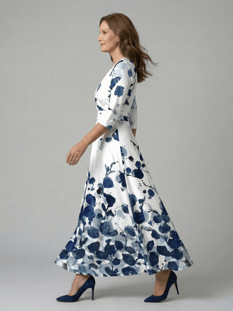 Celine™ wrap neck midi dress by Emma & Rose Cape Town, featuring a flowing silhouette and elegant design, displayed on a hanger.