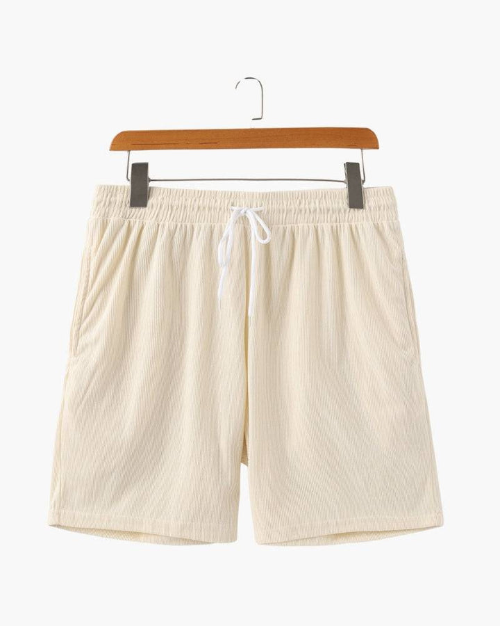 Emma & Rose Manhattan Dean™ Beachstride Shorts in vibrant blue with a relaxed fit and elastic waistband, perfect for summer beachwear.
