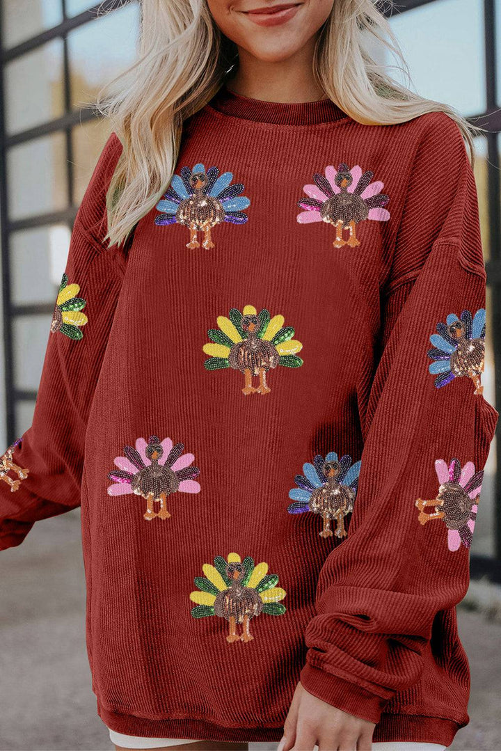 Racing Red Turkey graphic sequins patch corded sweatshirt from Emma & Rose Cape Town, showcasing a vibrant turkey design and casual fit.