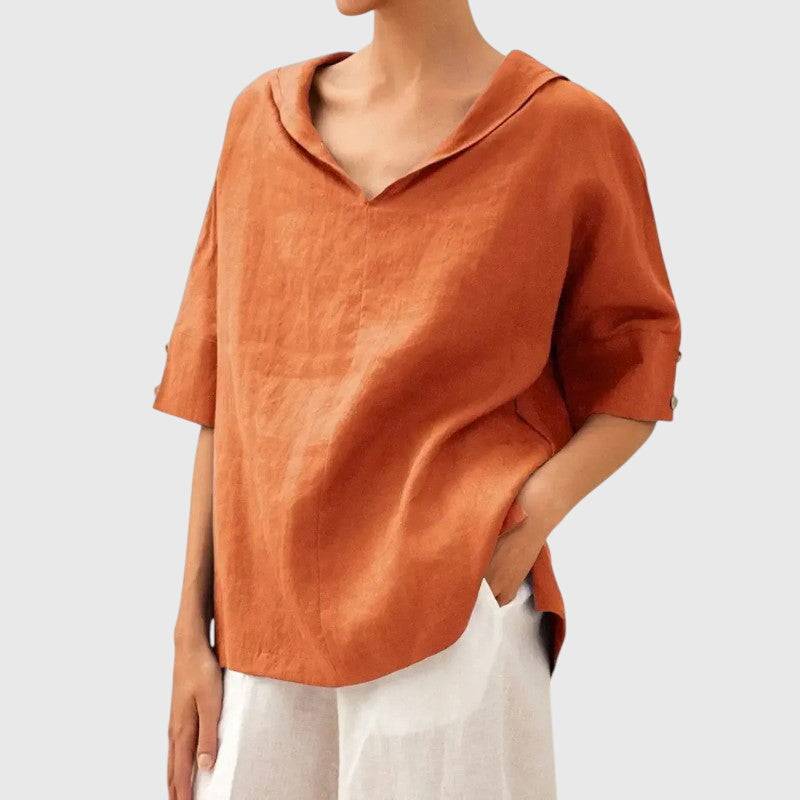 Ayla™ orange blouse by Emma & Rose Cape Town featuring flowy fabric and stylish collar detail on a model.