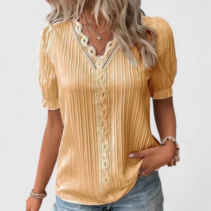 Elegant Emma & Rose Cape Town Avienne™ V-neck blouse in soft fabric, shown in a stylish V-neck design with subtle detailing.