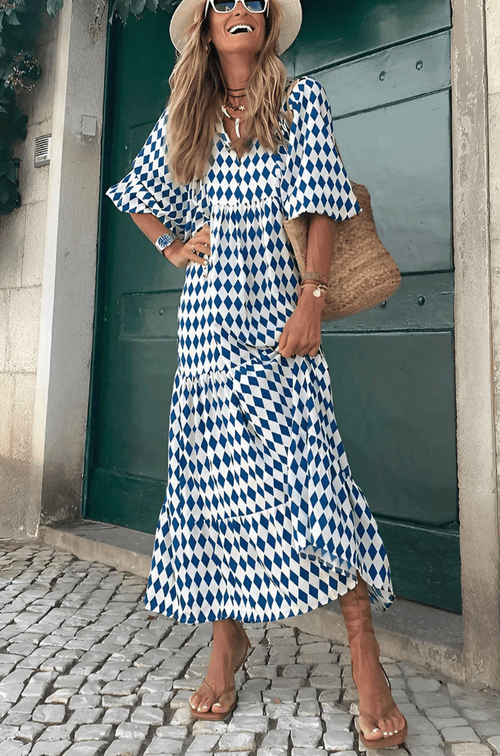 Emma & Rose Manhattan Vanessa™ long maxi dress with colorful printed fabric, flowing design, and sleeveless style.