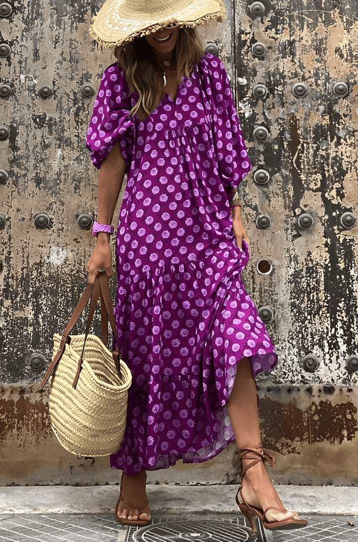 Emma & Rose Manhattan Vanessa™ long maxi dress with floral print, flowing fabric, and sleeveless design displayed in the image.