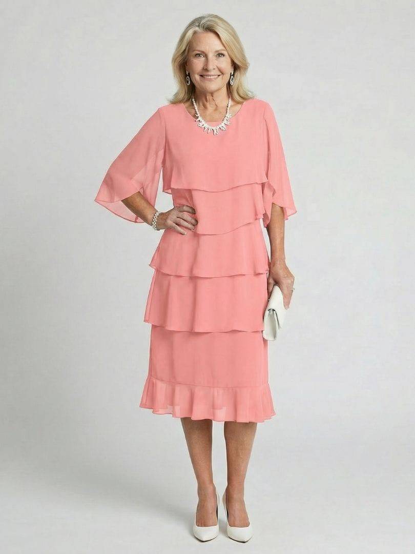 Emma & Rose Cape Town Brent™ layered tier midi dress, featuring flowing fabric and tiered design, shown on a model.
