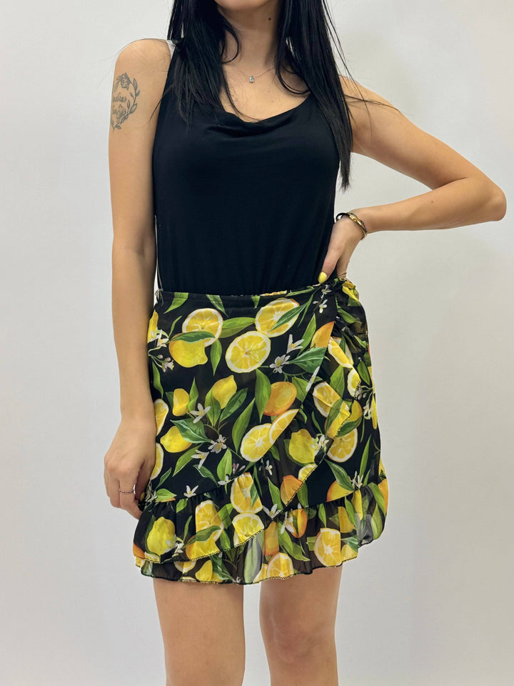 Emma & Rose Cape Town Carmen™ ruffled print mini skirt, showing a colorful ruffled design and lightweight fabric.