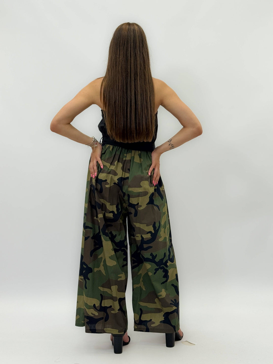 Veronique™ printed jumpsuit by Emma & Rose Cape Town, featuring vibrant floral patterns and modern fit, shown on a model.