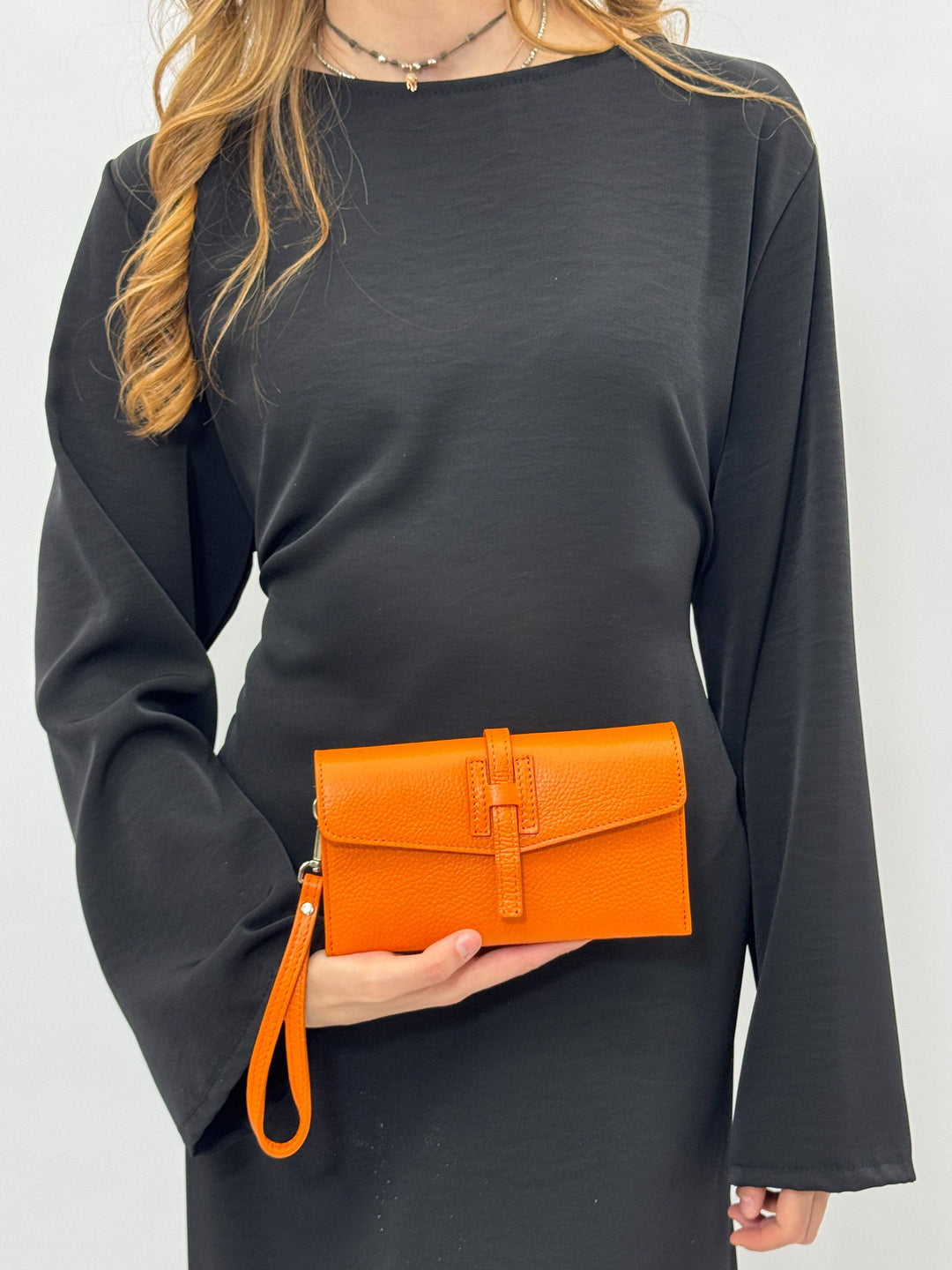 Emma & Rose Cape Town Yael™ clutch bag strap in soft luxurious fabrics, showcasing intricate detailing and elegant design.