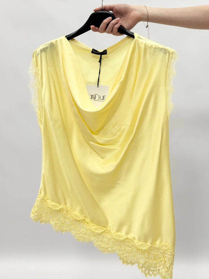 Emma & Rose Cape Town Francien™ maglieria top made of soft, luxurious fabrics with delicate details, displayed on a hanger.