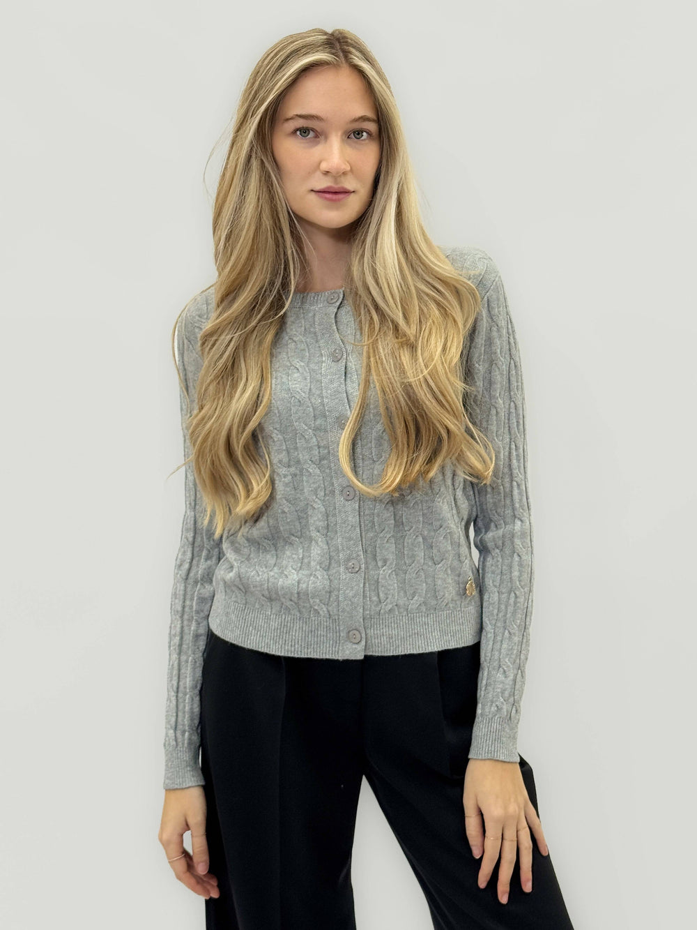 Elmarie™ cable knit cardigan by Emma & Rose Cape Town featuring a cozy, textured knit with a button-up front and classic fit.