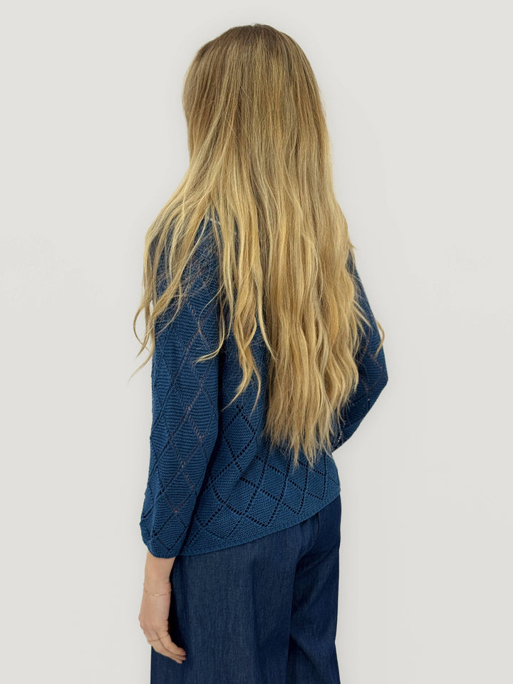 Emma & Rose Cape Town Ursula™ diamond-knit cardigan with soft, luxurious fabrics and button closure, shown on a model.