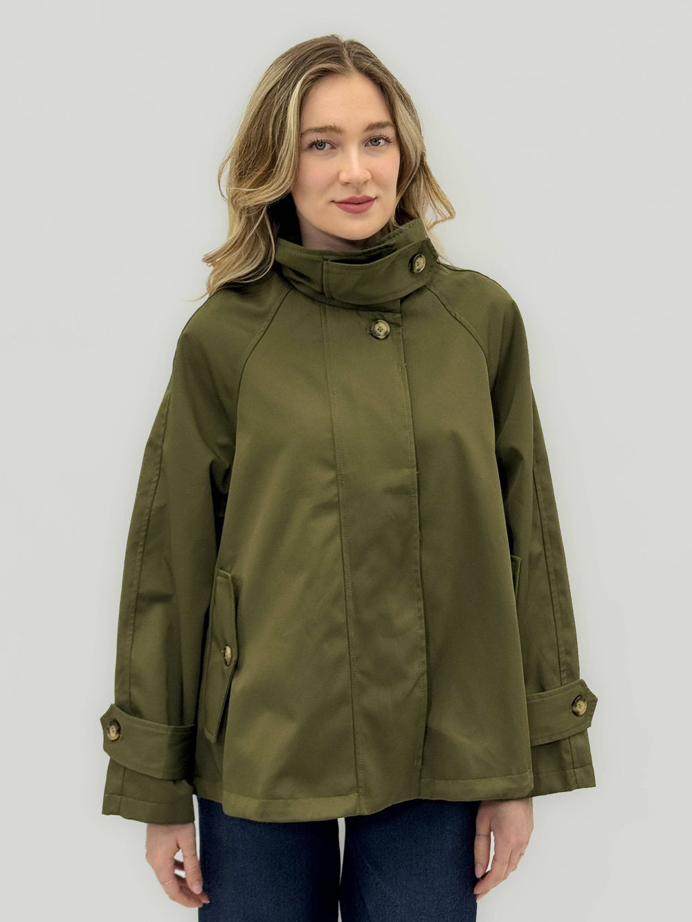 Emma & Rose Cape Town High™ Collar Trench coat, beige giacche with classic collar and tailored fit, hanging on a hanger.