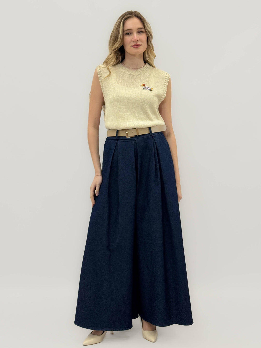 Esmé™ high-waisted palazzo trousers by Emma & Rose Cape Town featuring pleats and wide-leg design for a chic, flowy look.
