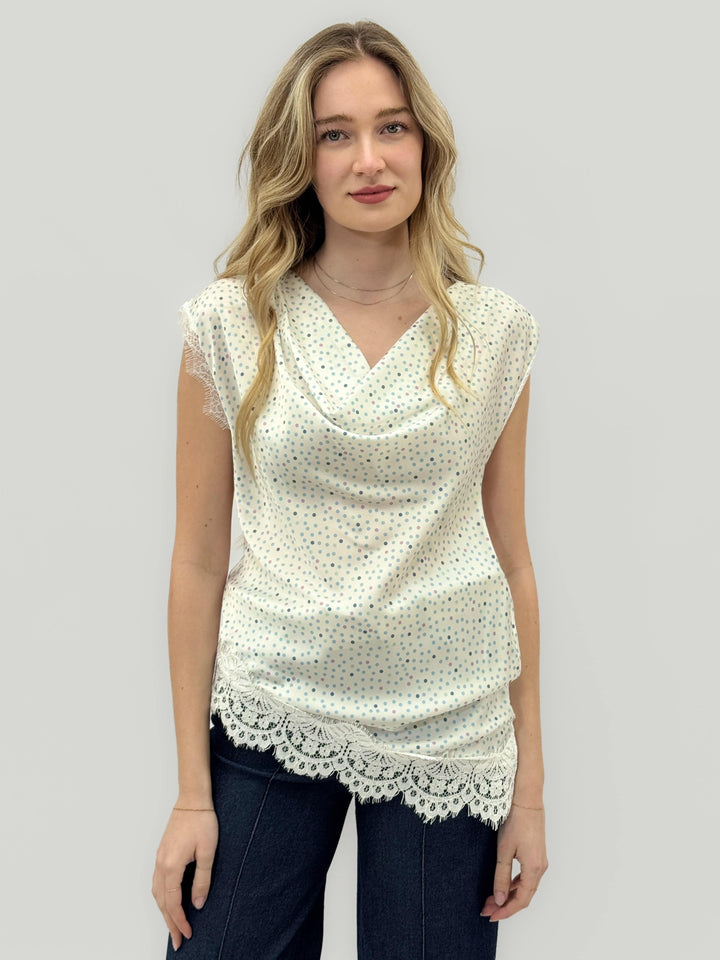Emma & Rose Odette™ maglieria top made from soft, luxurious fabrics, showcasing a cozy, elegant knit design in neutral tones.
