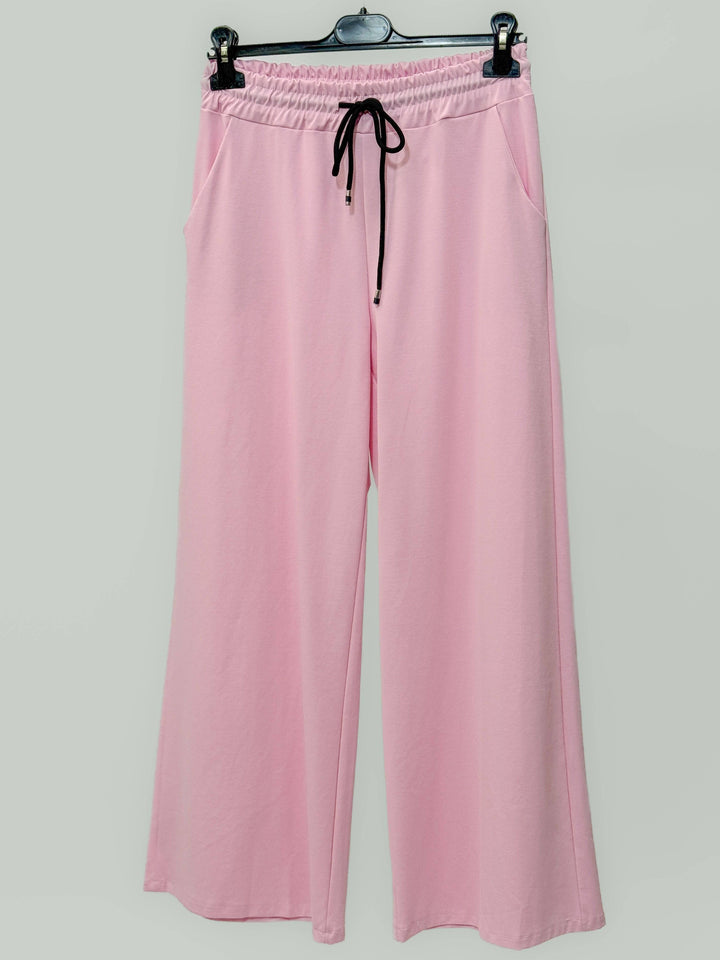Women's tailored palazzo trousers by Emma & Rose Cape Town, beige pantaloni with wide-leg fit and high waist.