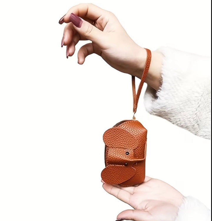 Bridget™ Mini Elephant Wallet by Emma & Rose Cape Town, featuring a compact leather wallet with embossed elephant design.