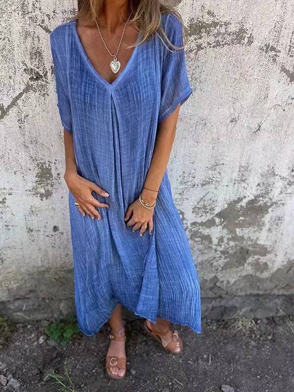 Emma & Rose Manhattan Elisabetta™ casual V-neck dress in soft fabric, displayed on a hanger with a neutral background.