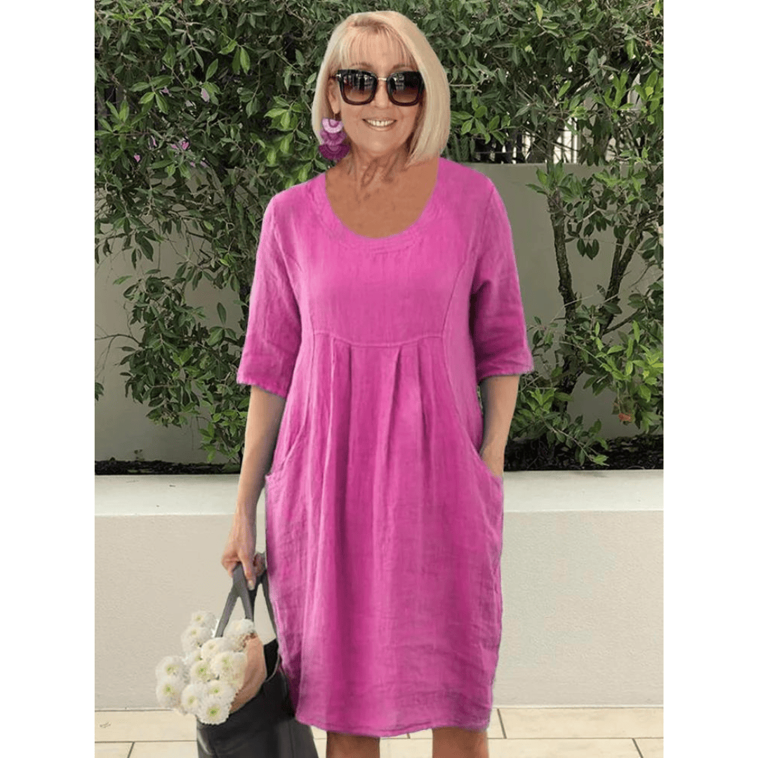 Emma & Rose Manhattan Gabriella summer dress featuring stylish pockets, lightweight fabric, and a vibrant floral pattern.